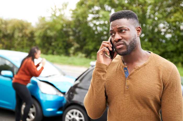 A person involved in a Car Accident making a phone call