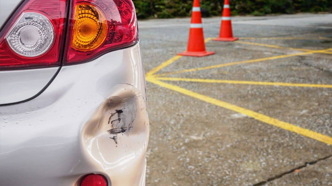 A picture of a minor car accident showing a dent on the car's bumper. It is important to know if can i report an accident after 24 hours ontario to ensure proper reporting and insurance coverage.