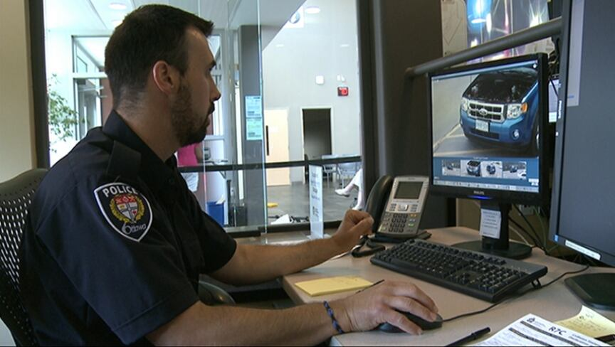A police officer at a collision reporting centre. *Image source credits to CBC News Ottawa. 