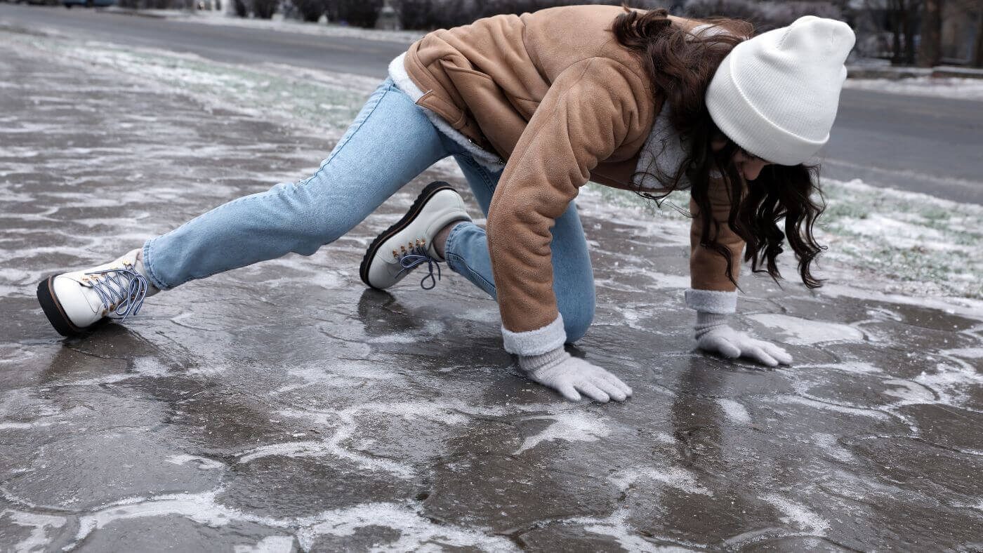 A person slipping on ice in a slip and fall injury
