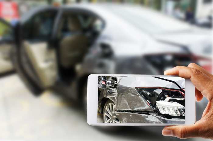 Taking a picture of a car accident