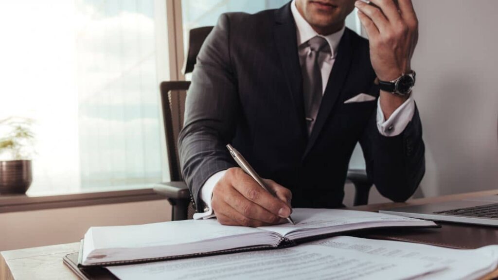 A picture of a person talking to a lawyer, discussing a successful personal injury mediation