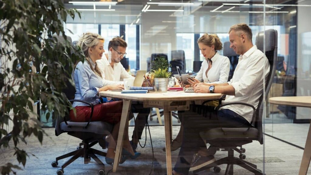 A group of professionals discussing personal injury mediation in a conference room
